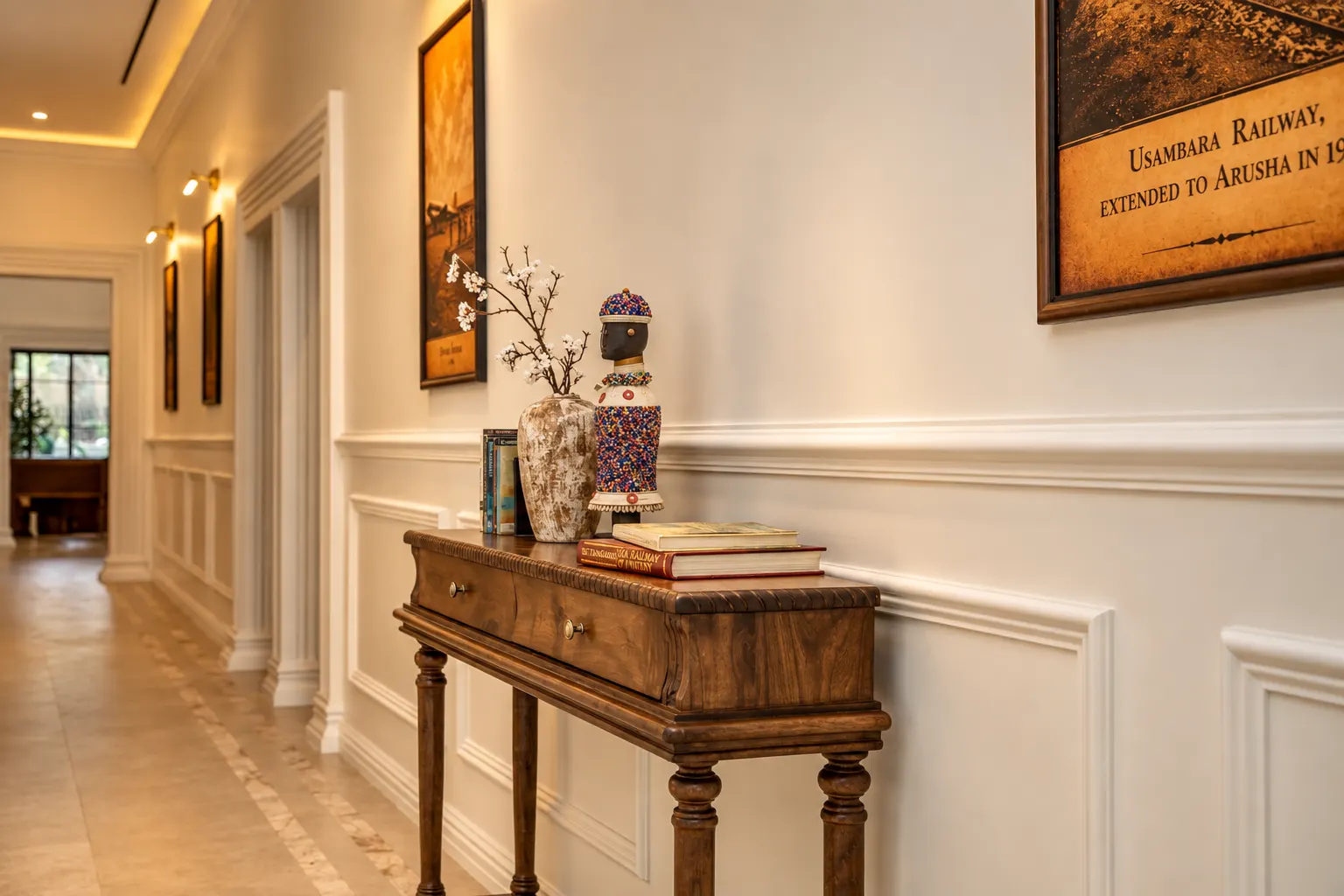 The Garden Table dining room at Haile, with patterned walls, timber tables and a chandelier.